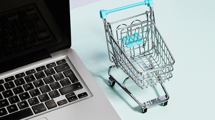 laptop with toy shopping cart